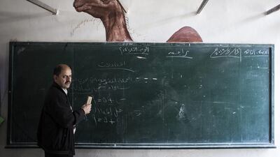A teacher is seen at a Palestinian Bedouin of Jahaline tribe school.