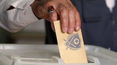 A Lebanese man casts his vote at a polling station during the municipal elections in Beirut, Lebanon, Sunday, May 8, 2016. Hassan Ammar / AP Photo