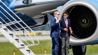 US Treasury Secretary Scott Bessent, left, and Federal Reserve Chairman Kevin Warsh talk before entering a motorcade on arrival in Asheville, North Carolina, where talks will be crucial. Reuters