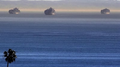 Cargo ships stand at anchor outside the Ports of Los Angeles and Long Beach, seen in this view from the San Pedro area of Los Angeles, on Thursday, February 12, 2015. Seaports in major West Coast cities that normally are abuzz with the sound of commerce are falling unusually quiet. Companies that operate marine terminals said they weren't calling workers to unload ships on Thursday that carry car parts, furniture, clothing, electronics — just about anything made in Asia and destined for US consumers. Containers of US exports won't get loaded either. Nick Ut / AP Photo