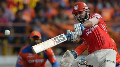 Kings XI Punjab captain Murali Vijay plays a shot during the 2016 Indian Premier League (IPL) Twenty20 cricket match between Gujarat Lions and Kings XI Punjab at The Saurashtra Cricket Association Stadium in Rajkot on May 1, 2016. AFP/PUNIT PARANJPE