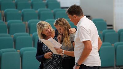 A student reacts after collecting her A-Level exam results at Edgbaston High School for Girls in Birmingham. Darren Staples / Reuters