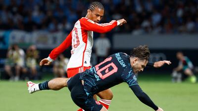 Bayern Munich's Leroy Sane clashes with Manchester City's Jack Grealish. Reuters