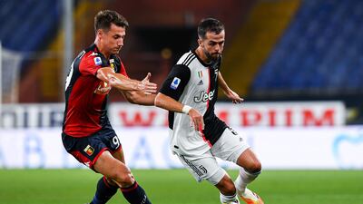 Andrea Pinamonti of Genoa and Miralem Pjanic of Juventus vie for the ball. Getty Images