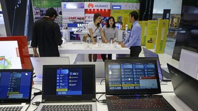Dubai, United Arab Emirates - March 26, 2017. Value Added Tax will affect electronic items such as laptops, at Jacky's Electronics shop in Dubai mall. ( Jeffrey E Biteng / The National ) Editor's Note; ID 90307