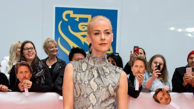 Jena Malone paired satin gloves with a snake-print Emilia Wickstead dress. Photo / EPA