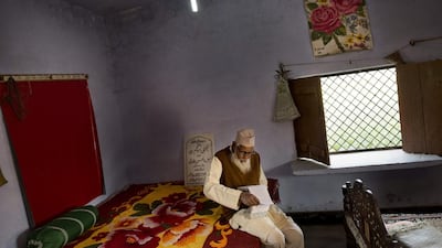 Mr Qadri reviews a note book with love poems he wrote for his wife Tajammuli. ‘We were just a normal couple,’ said Mr Qadri.