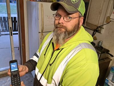 Dave Reidy shows images captured the night of the train derailment and fire in this February 22, 2023 photo. Stephen Starr