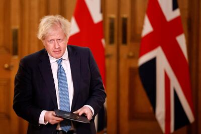 Britain's Prime Minister Boris Johnson arrives to attend a virtual press conference on the COVID-19 pandemic. AFP