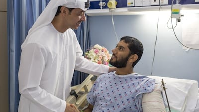 Sheikh Hazza bin Zayed, National Security Adviser and Deputy Chairman of Abu Dhabi Executive Council, visits a UAE Armed Forces soldier at Zayed Military Hospital.