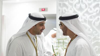 Sheikh Mohammed bin Zayed, Crown Prince of Abu Dhabi and Deputy Supreme Commander of the Armed Forces, right, speaks with Sheikh Mohammed Abdulla Al Mubarak Al Sabah, Minister of Cabinet Affairs of Kuwait, left, during the final race of the 2014 Formula 1 Etihad Airways Abu Dhabi Grand Prix, at Yas Marina Circuit. Ryan Carter / Crown Prince Court — Abu Dhabi