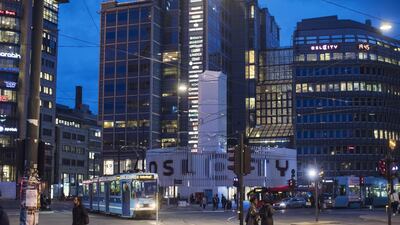 City trams operate at night in the city center in Oslo, Norway. The chief executive of the country's sovereign wealth fund is pondering what is to come of its portfolio amid the US-China trade war. Bloomberg