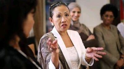 Wendy Lewis, the president of the Diplomatic Group for Spouses of Ambassadors, presented proceeds from the book, On the Wings of a Tale, to the Al Ain Care and Rehabilitation Centre. Delores Johnson / The National