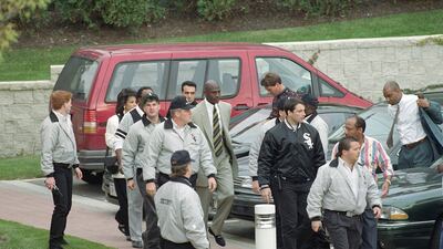 Jordan is surrounded by Comiskey Park security as he arrives at the Berto Centre in Deerfield, Illinois to announce his retirement from professional basketball in 1993. AP