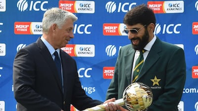 Pakistan cricket captain Misbah-ul-Haq, right, receives the Test mace from ICC chief executive David Richardson in September after Pakistan reached the top of the rankings. Arif Ali / AFP