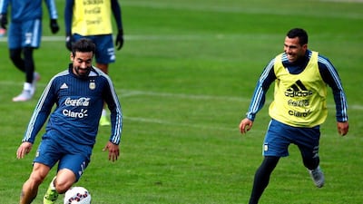 Argentina's Ezequiel Lavezzi, left, and Carlos Tevez, shown during Wednesday's training session ahead of the Copa America final on Saturday. Osvaldo Villaroel / EPA