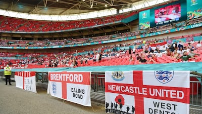England fans display flags inside the stadium prior to the match on Sunday. Getty