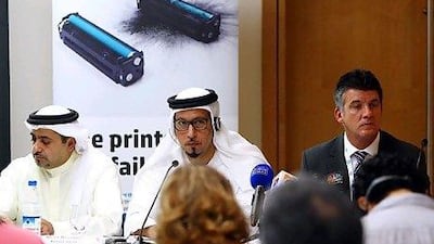 First Lieutenant Khalid Al Muhairi, the head of the anti-commercial deception and piracy division, Dubai Police, left; Major Rashed Mohammad Saleh, deputy director of anti-economic crimes department, Dubai Police, centre; and Glenn Jones, the investigations and enforcements operations manager at HP. Satish Kumar / The National