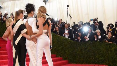 (R-L) Cara Delevigne, Rihanna, Stella McCartney, and Reese Witherspoon arrive at the Costume Institute Benefit at The Metropolitan Museum of Art 5 May, 2014 in New York. AFP