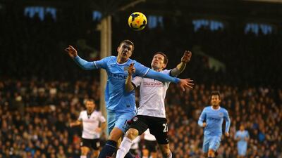 Edin Dzeko and his Manchester City teammates came out ahead in most of the battles against Sascha Riether and host Fulham. Clive Rose / Getty Images