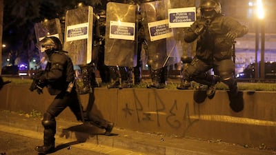 Police officers take position at the Catalan pro-independence protest outside the Camp Nou stadium. AP
