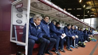 Manchester City manager Manuel Pellegrini, left, followed the resounding success of his first year at City, in which he won the Premier League and League Cup, with a disappointing season that ended with the big-spending club surrendering the title to Chelsea and finishing empty-handed in May. Reuters / Carl Recine