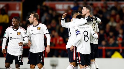 Tyrell Malacia - 7 Lively, tough tackling. Rewarded with a kiss on the head by his compatriot Weghorst after the second goal. Action Images