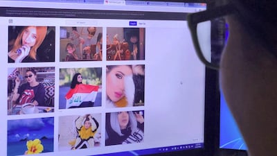 A viewer looks at the profile page of Iraqi model and Instagram starlet Tara Fares in Baghdad. AFP