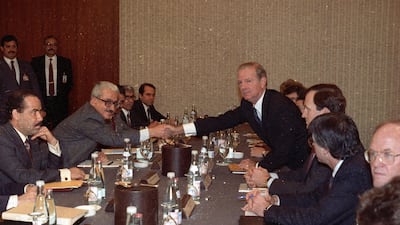 US Secretary of State James Baker (5th R) and Iraqi Foreign Minister Tariq Aziz in Geneva January 9, 1991. The meeting failed to convince Saddam to leave Kuwait, setting the scene for the Gulf War. Reuters