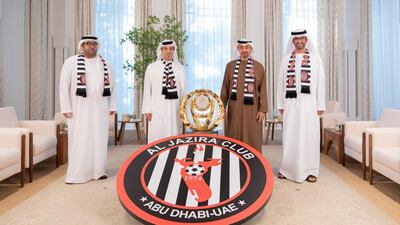 From left to right: Sheikh Mohamed bin Hamdan bin Zayed, Ruler's Representative in Al Dhafra Region, Honorary President of Al Jazira Club and Chairman of the Honorary Board, Sheikh Mansour bin Zayed, Sheikh Mohamed bin Zayed, and Dr Sultan Al Jaber, Al Jazira Club Vice President and Chairman of Executive Committee, stand for a photograph with the Arabian Gulf League trophy at Al Shati Palace. Mohamed Al Hammadi / Ministry of Presidential Affairs