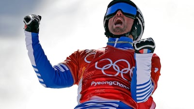 Pierre Vaultier, of France, celebrates after winning gold during the men's snowboard cross final at Phoenix Snow Park at the 2018 Winter Olympics. Gregory Bull / AP Photo