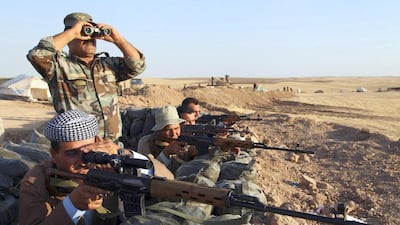 Kurdish peshmerga troops keep guard during an intensive security deployment against Islamic State militants on the frontline in Khazer. The US and the EU have agreed to supply Kurdish troops with weapons (REUTERS/Azad Lashkari)