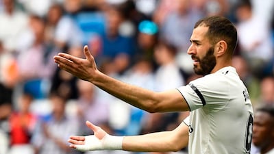Real Madrid's French forward Karim Benzema gestures towards the referee. AFP