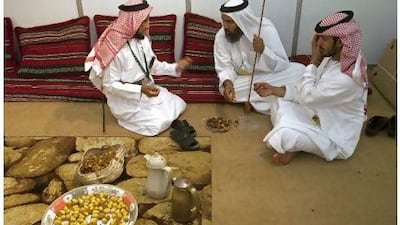 Men discuss the quality of the dates at the Ajman-Liwa Date Festival in Ajman.