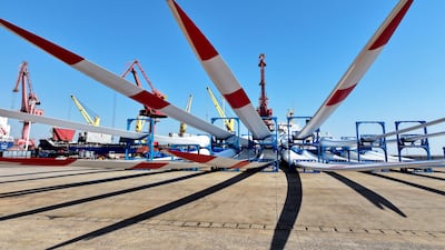 Wind turbine blades on the dock waiting to be loaded on to a ship for export at the port of Lianyungang, in China’s eastern Jiangsu province. AFP