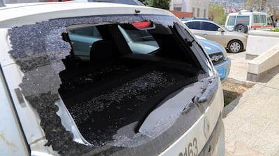 The shattered rear window of the Red Cross vehicle that was carrying Red Cross employee Hanna Lahoud, parked outside a hospital in the country's third-city of Taiz. A Red Cross employee was killed in Yemen's southern city of Taez, an ICRC spokesman said, after a gunman had opened fire on an ICRC vehicle in the Zabab district in the west of the city. Ahmad Al Basha / AFP / April 21, 2018