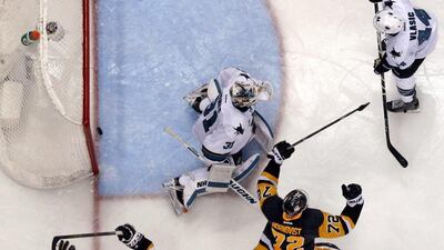 Pittsburgh Penguins celebrate the winning goal of Game 2 of the NHL Stanley Cup Final against the San Jose Sharks. Gene J Puskar / AP Photo