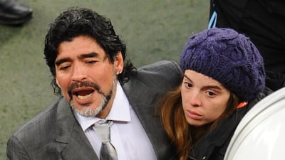 Diego Maradona, left, is comforted by his daughter Dalma, as he leaves the field after losing to Germany in a 2010 World Cup quarter-final match at Green Point stadium in Cape Town, South Africa, on July 3, 2010. Germany won 4-0. Christophe Simon / AFP