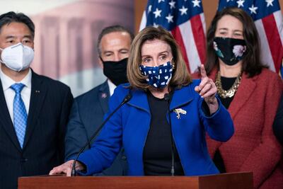 Speaker Nancy Pelosi, with House impeachment managers, speaks to the press after the Senate voted to acquit former US President Donald Trump, in the US Capitol in Washington, on February 13, 2021. AFP