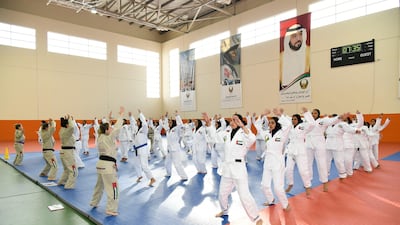 Emirati pupils take part in a military training summer camp at the National Service Training Centre in Al Ain. Wam