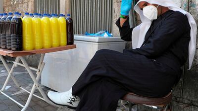 A Palestinian vendor waits for customers in the occupied West Bank city of Ramallah. AFP