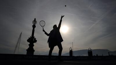 Swiss tennis champion Roger Federer serves a ball in Geneva during a presentation ahead of the Laver Cup tournament that will take place in Geneva next September. AFP