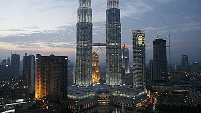 Kuala Lumpur's Petronas Towers, as viewed from the newly refurbished, 33rd-floor SkyBar, anchor the city's skyline and briefly enjoyed status as the world's tallest building before being surpassed by Taipei 101.