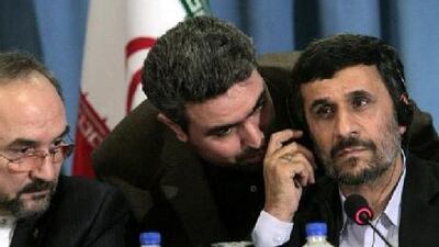 Iran's U.N. ambassador Mohammad Khazaei, left, listens as Iranian President Mahmoud Ahmadinejad, right, confers with an aide during a press conference in New York, Friday Sept. 24, 2010. (AP Photo/Bebeto Matthews) *** Local Caption *** NYBM105_UN_Iran_Ahmadinejad.jpg