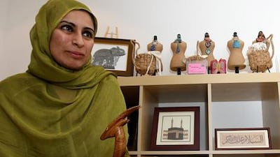 DUBAI, UNITED ARAB EMIRATES ? Nov 22: Sabeena Ahmed who works with Fairtrade Foundation showing snack holder at her home in Al Barsha in Dubai. This snack holder is made by Sissoo wood. (Pawan Singh / The National) For Motoring. Story by Maey