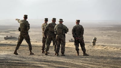 US soldiers survey the terrain during the Iron Union training drill. Chris Whiteoak / The National
