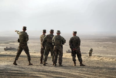 US soldiers survey the terrain during the Iron Union training drill. Chris Whiteoak / The National