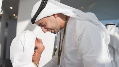 Sheikh Khaled bin Zayed Deputy Chairman of Etihad Airways (R), greets a guest during the final race of the Formula 1 Etihad Airways Abu Dhabi Grand Prix at Yas Marina Circuit. Mohamed Al Hammadi / Crown Prince Court - Abu Dhabi