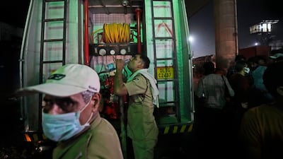 A fire official quenches his thirst. AP