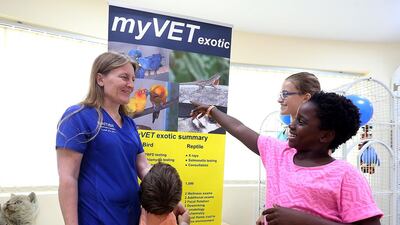 Dr Sara Elliott teaches children to take care of exotic pets at the British Veterinary Hospital in Dubai. Satish Kumar / The National